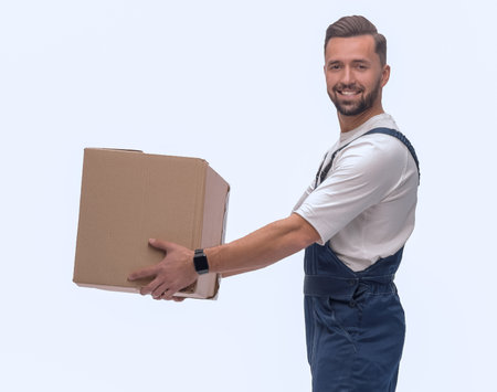 side view. happy man with a cardboard boxの写真素材