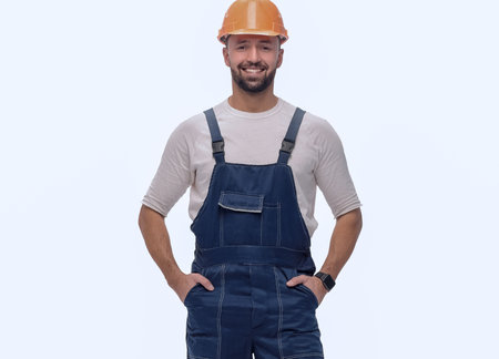 confident man in overalls . isolated on whiteの写真素材