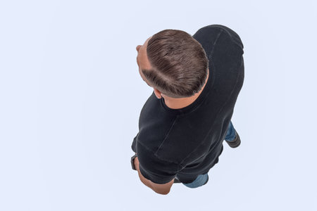 top view. confident young man. isolated on whiteの写真素材