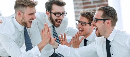 Happy excited business team, gives each other a high five