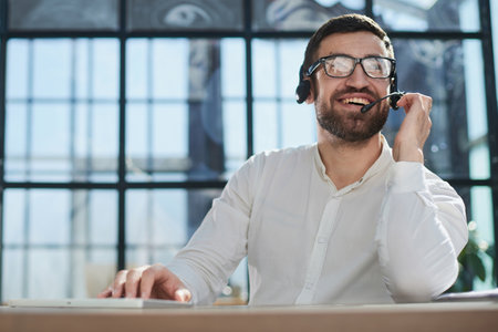 Hotline and helpdesk support operator working in office