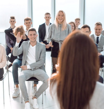 rear view. businesswoman asks questions to the audience during the seminarの写真素材