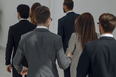 business team walks through the office halの写真素材