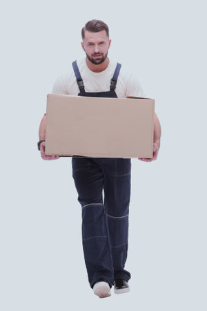 in full growth. a smiling man with cardboard boxes on his shouldersの写真素材