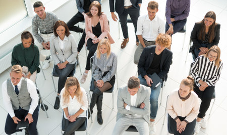 top view. listeners ask a question at a business seminarの写真素材