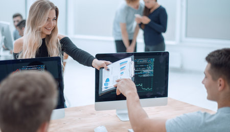 office employees analyzing the information received in the officeの写真素材