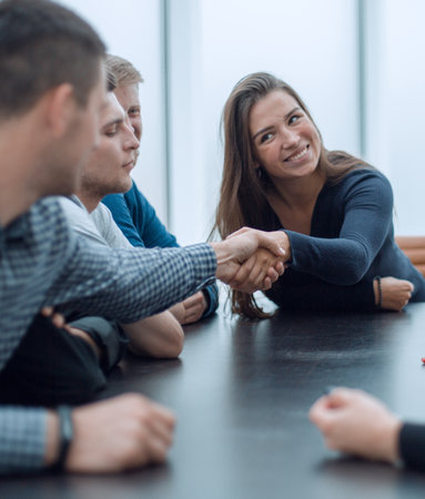 businesswoman shaking hands with a colleague during a working meetingの写真素材