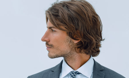Handsome young business man looking away.の写真素材