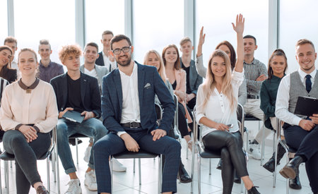 students ask questions during the business seminarの写真素材