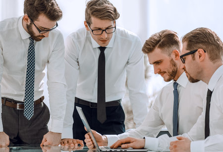 group of employees discussing the incoming informationの写真素材