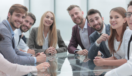 group of young business people sitting at a table in a conference room.の写真素材