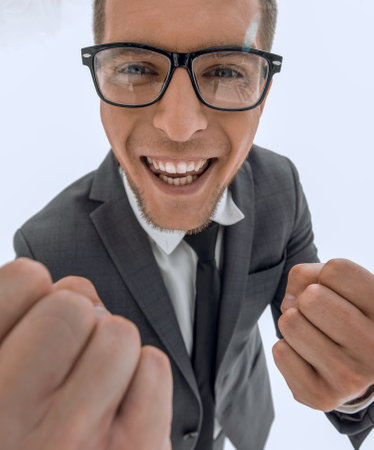 Businessman celebrating with his fists raised in the airの写真素材