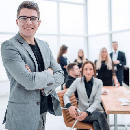 confident business man standing in the officeの写真素材