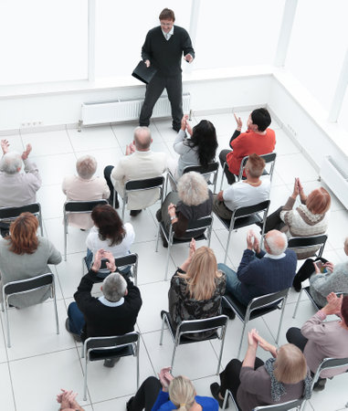 audience asks a question to the speaker during the seminarの写真素材