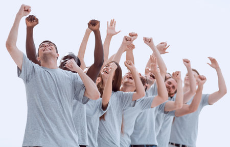 group of happy young people with hands up