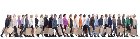 a group of people are running paper shopping bagsの写真素材