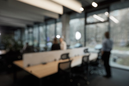 A blurry image of a group of people sitting at a table