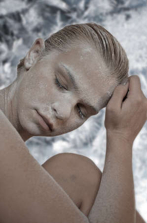 Portrait of young woman with snow make-upの写真素材