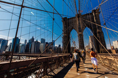 Spring April 2015 People walking on Brooklyn Bridge, New York United Statesのeditorial素材