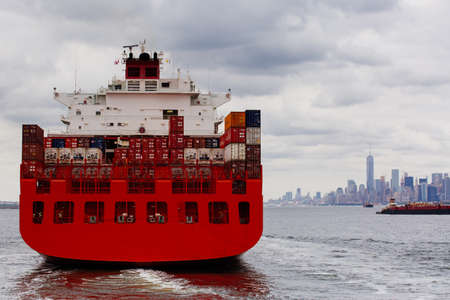 Container ship on East River with Lower Manhattan Skyline, New York USAのeditorial素材
