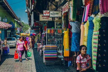 Yangon, Myanmar - FEB 19th 2014: People walking on the street out of Bogyoke Aung San Marketのeditorial素材