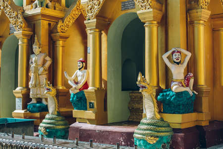 Yangon, Myanmar - FEB 19th 2014: Close up of golden buddha statue at Shwedagon Pagodaのeditorial素材