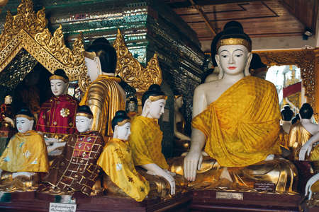 Yangon, Myanmar - FEB 19th 2014: Close up of Golden buddha statue at Shwedagon golden pagodaのeditorial素材