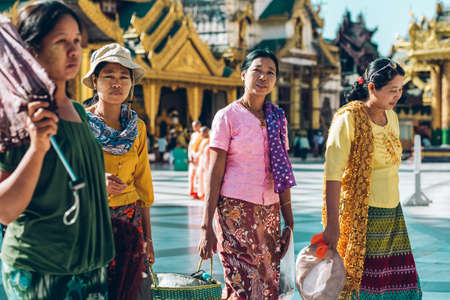 Yangon, Myanmar - FEB 19th 2014: Burmese female walk at Shwedagon Pagodaのeditorial素材