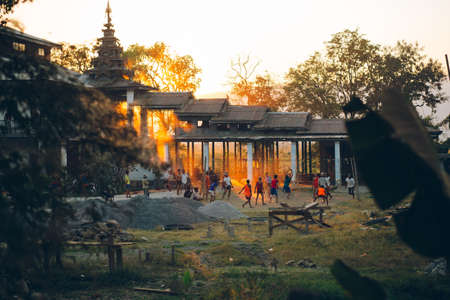Inle Lake, Myanmar - FEB 24th 2014: Children are playing soccer at the temple during sunset timeのeditorial素材