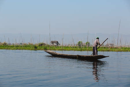Inle Lake, Myanmar - FEB 25, 2014: Intha people work on floating garden on Inle Lake, Myanmarのeditorial素材