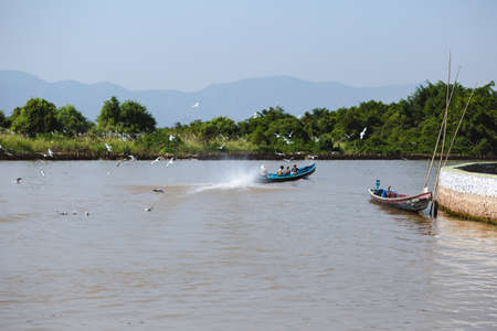 Inle Lake, Myanmar - FEB 25th 2014: An environment with motor boat in Inle Lake, Myanmarのeditorial素材