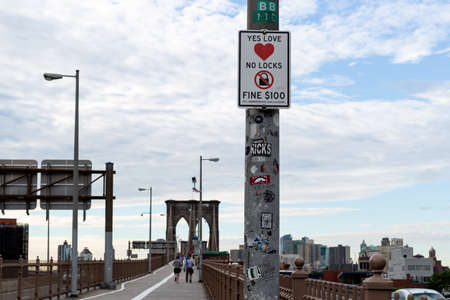 New York City / USA - JUN 20 2018: Fine sign on the Brooklyn Bridge in New York Cityのeditorial素材