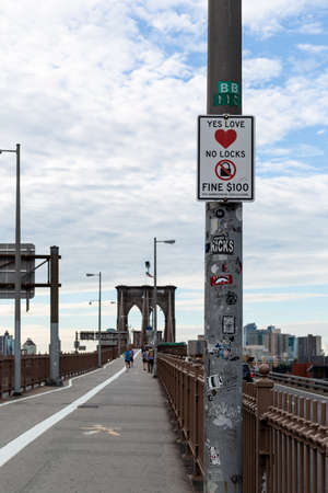 New York City / USA - JUN 20 2018: Fine sign on the Brooklyn Bridge in New York Cityのeditorial素材