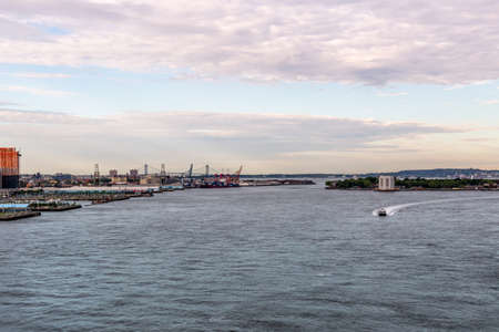 New York City / USA - JUN 20 2018: East river with Brooklyn piers and Governors Island at early morning in New York Cityのeditorial素材