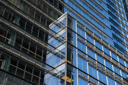 New York City / USA - JUL 13 2018: Building reflection of The New York Times Building in midtown...