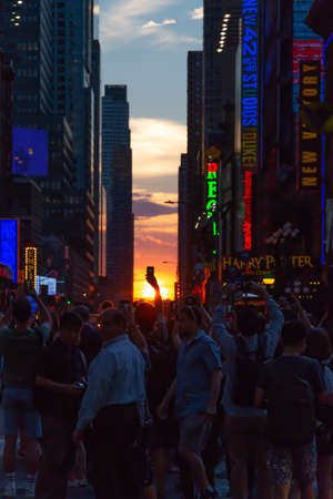 New York City / USA - JUL 13 2018: Manhttanhenge street view from Times Square at rush hour in midtown Manhattanのeditorial素材