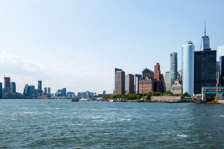 New York City / USA - JUL 14 2018: Lower Manhattan Skyline view from Governors Island ferry on a clear afternoonのeditorial素材