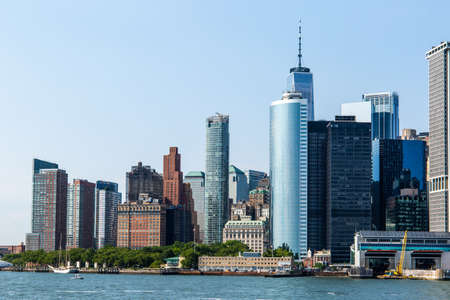 New York City / USA - JUL 14 2018: Lower Manhattan Skyline view from Governors Island ferry on a...