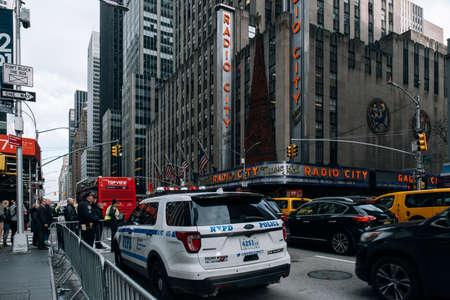 New York City - USA - DEC 17 2018: Perspective view street scene of Radio City building in midtown...