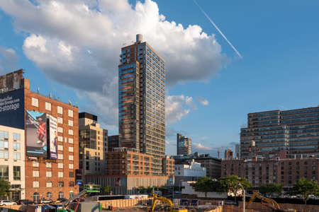 New York NY - USA - Jul 24 2019: The High Line Park in New York with locals and tourists. The High Line is a popular linear park built on the elevated train tracks above Tenth Ave in New York Cityのeditorial素材
