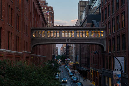New York NY - USA - Jul 24 2019: The High Line Park in New York with locals and tourists. The High Line is a popular linear park built on the elevated train tracks above Tenth Ave in New York Cityのeditorial素材