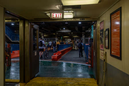 New York NY - USA - Aug 14 2019: Staten Island Ferry on the New York Harbor against of Lower...