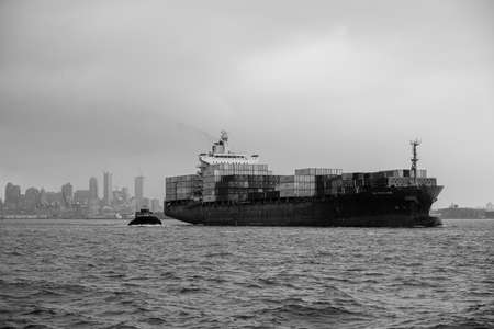 New York NY - USA - Aug 14 2019: Staten Island Ferry on the New York Harbor against of Lower...