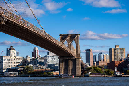 New York City - USA - Oct 18 2019: Brooklyn Bridge in daylight view from Lower East Side waterfrontのeditorial素材