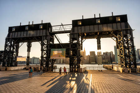 Queens NY - USA - Aug 29 2019: Long Island City Gantry sign and Manhattan midtwon skyline in front...
