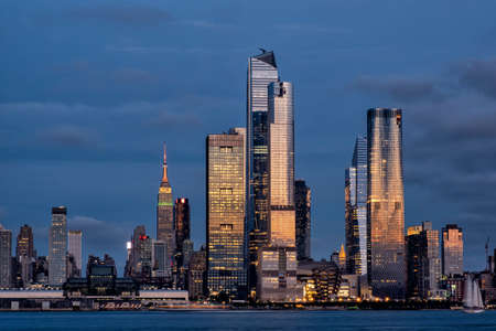 New York City - USA - Aug 15 2019: Sunset at Hudson Yards skyline of midtown Manhattan view from...