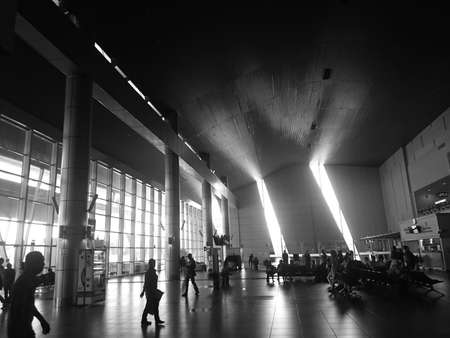 Business travel, silhouettes of walking people in the airportのeditorial素材