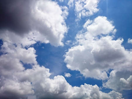 White and dark cloudy with blue sky