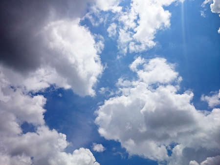 White and dark cloudy with blue sky