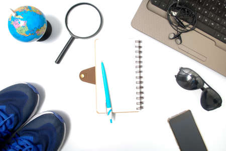 Travel item from top view. Flat lay isolated with white backgroundの写真素材